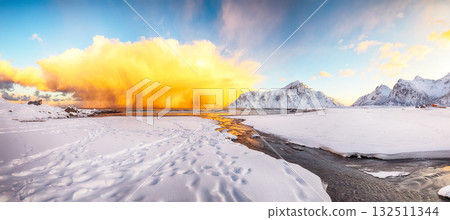 Amazing winter scenery on Skagsanden beach with illuminated clouds during sunrise 132511344
