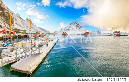 Breathtaking winter sunrise over Ramberg village and harbour. 132511355