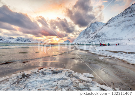 Stunning winter scenery with Haukland beach during sunset and snowy  mountain peaks near Leknes. 132511407