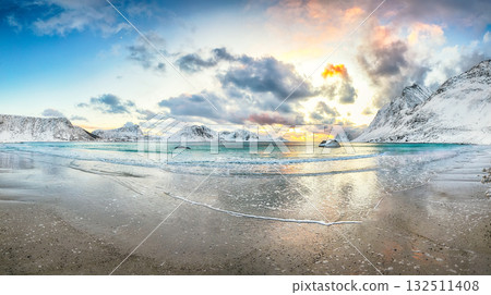Stunning winter scenery with Haukland beach during sunset and snowy  mountain peaks near Leknes. 132511408