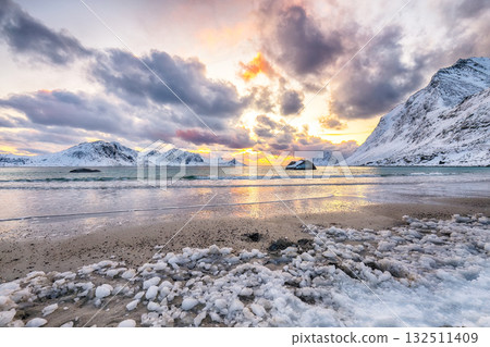Amazing winter scenery with Haukland beach during sunset and snowy  mountain peaks near Leknes. 132511409