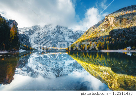 Autumn scenery of peaceful alpine lake Braies. Location Dolomiti Alps, Italy, Europe. Autumn scenery of peaceful alpine lake Braies. Location Dolomiti Alps, Italy, Europe. 132511483