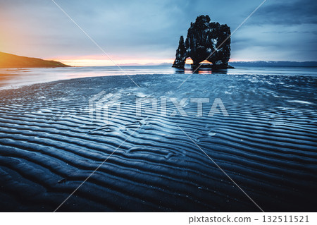 Ribbed dark sand after the tide. Location place Hvitserkur, Iceland, Europe. 132511521