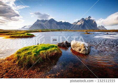 Beautiful mountain landscape on sunny day. Location Stokksnes cape, Vestrahorn, Iceland, Europe. Beautiful mountain landscape on sunny day. Location Stokksnes cape, Vestrahorn, Iceland, Europe. 132511555