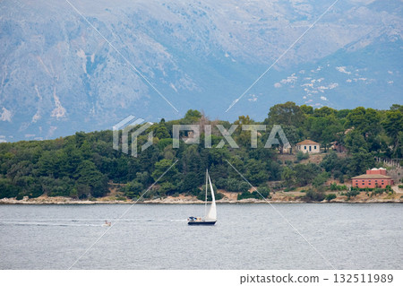A yacht sails in the Ionian Sea A yacht sails in the Ionian Sea 132511989