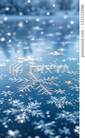 Close-up of snowflakes on blue surface 132512996