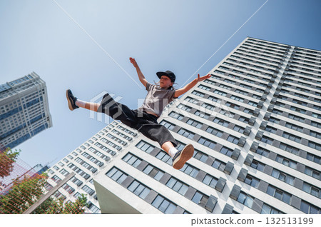 A girl jumps on a gymnastic trampoline. 132513199