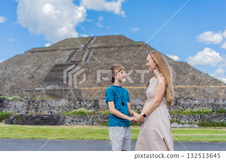 Mother and her son as tourists in front of Teotihuacan pyramids, Mexico, enjoying sightseeing, family travel, and cultural exploration together Mother and her son as tourists in front of Teotihuacan pyramids, Mexico, enjoying sightseeing, family travel, and cultural exploration together 132513645