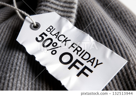 Black Friday 50% Off Sale Tag on Grey Knitwear. AI generated Black Friday 50% Off Sale Tag on Grey Knitwear. AI generated 132513944