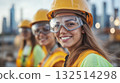 Female construction workers, white women in safety gear at urban building site 132514298