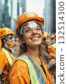 Smiling female construction worker in safety gear at urban construction site 132514300