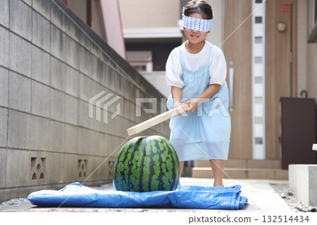 Girls enjoying watermelon smashing Girls enjoying watermelon smashing 132514434