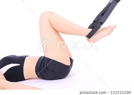Woman doing suspension training Woman doing suspension training 132515290