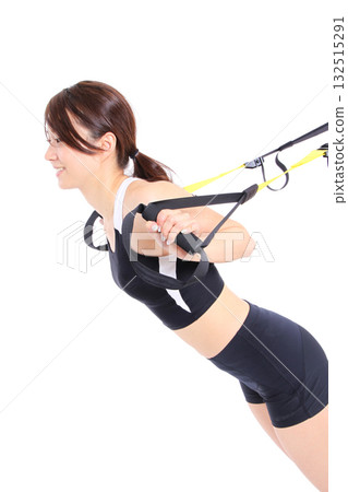 Woman doing suspension training Woman doing suspension training 132515291