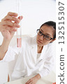 Researchers looking at test tubes 132515307