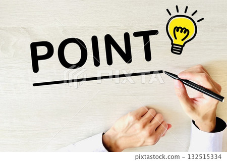 Hand writing the word "point" on a desk Hand writing the word "point" on a desk 132515334