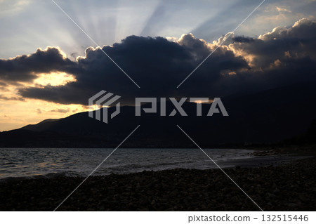 Dark clouds over Turkish mountains and beach Dark clouds over Turkish mountains and beach 132515446