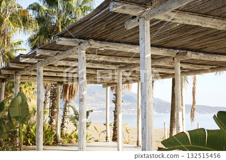 Bamboo pergola by the beach with mountain view Bamboo pergola by the beach with mountain view 132515456
