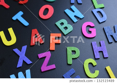 colorful letter alphabet on black background, object for education 132515489