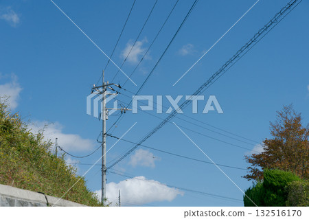 Utility poles and blue sky Utility poles and blue sky 132516170
