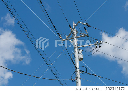Utility poles and blue sky Utility poles and blue sky 132516172