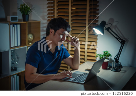man thinking and working with laptop at night man thinking and working with laptop at night 132516220