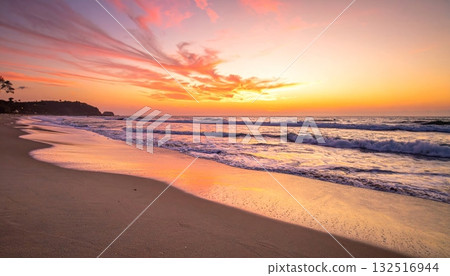 A vibrant orange sunset over the calm sea casts a reflection on the wet beach sand A vibrant orange sunset over the calm sea casts a reflection on the wet beach sand 132516944