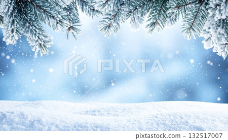 A snowy winter landscape with a decorated Christmas tree under a blue sky 132517007