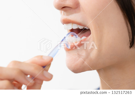 Woman taking care of her teeth Woman taking care of her teeth 132517263