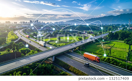 Mountain landscape with a truck driving on the highway under a clear sky, depicting transport and travel 132517409