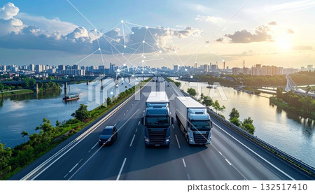 Mountain landscape with a truck driving on the highway under a clear sky, depicting transport and travel 132517410