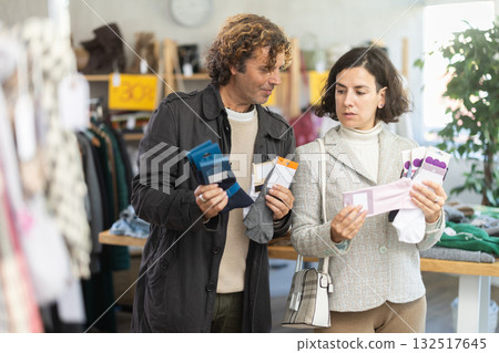 couple choose sets of socks 132517645