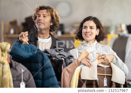 Family shopping, international couple purchase warm clothes in shop 132517967