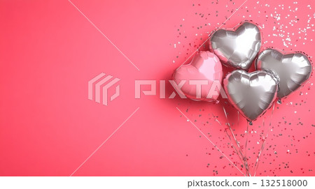 Pink and silver heart shaped balloons floating on a coral background with glitter create a festive atmosphere, perfect for valentine's day, anniversaries, or romantic celebrations 132518000