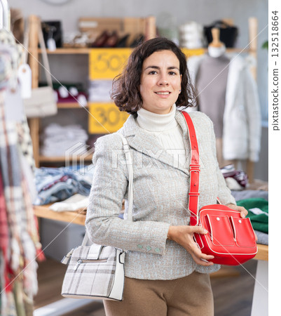 Adult woman choosing a comfortable bag Adult woman choosing a comfortable bag 132518664