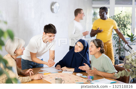 Group of multinational students of different years play board game with passion Group of multinational students of different years play board game with passion 132518816