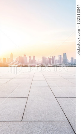 Featuring empty square floor tiles alongside a modern city skyline panorama in shanghai, china, during sunset, creating an ideal backdrop for car advertising and promotions 132518844