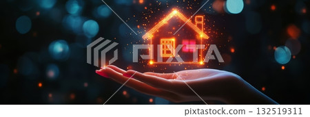 Woman's hand holds a glowing orange house icon, symbolizing modern real estate solutions and secure investments in a digital world 132519311