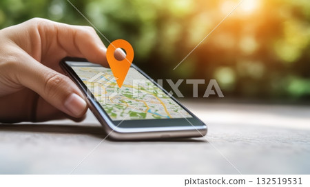 Woman holding a smartphone and using a navigation app to find her location outdoors, with an orange location pin hovering over the map displayed on the screen 132519531