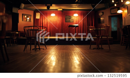 empty chairs in a dimly lit bar with stage 132519595