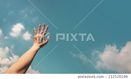 Hand reaching toward the bright blue sky, symbolizing freedom, hope, positivity Hand reaching toward the bright blue sky, symbolizing freedom, hope, positivity 132520286