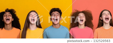 Five multi ethnic teenagers wearing colorful t shirts are laughing out loud with their eyes closed, possibly singing together, showing pure joy and happiness on a vibrant two tone background 132520563