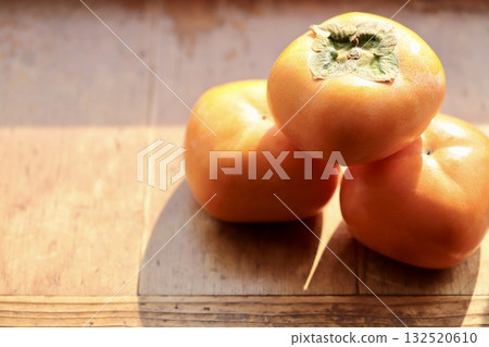Ripe seedless persimmons: a taste of autumn 132520610