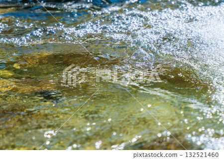 Early summer waterside: Close-up of the clear stream's water surface 139 132521460