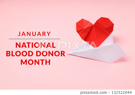 Red origami heart on a white boat, pink backdrop Red origami heart on a white boat, pink backdrop 132522044