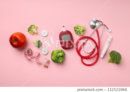Medical gear and healthy foods on a pink backdrop Medical gear and healthy foods on a pink backdrop 132522068