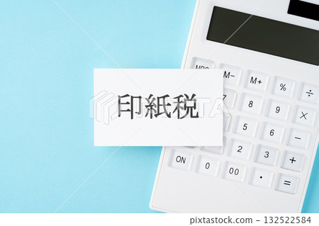 Stamp duty text and calculator on light blue background 132522584