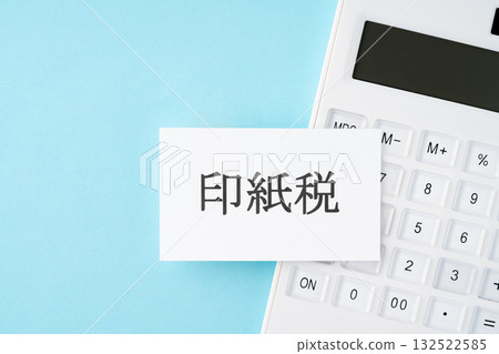 Stamp duty text and calculator on light blue background 132522585
