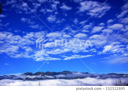 Sea of clouds in the Central Alps and sardine clouds in the sky 132522895