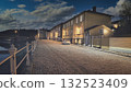 Porvoo, Finland - December 08, 2020: Cobblestone street scene at night, featuring illuminated buildings and a serene atmosphere, reflecting calmness and urban charm 132523409